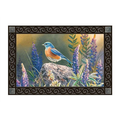 Studio M Flower Watching MatMate Doormat with bluebird on rock surrounded by purple flowers, made of recycled rubber and durable polyester.