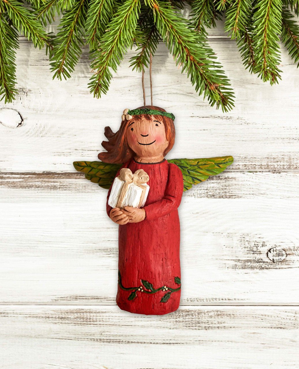 Studio M Life's Gifts Angel Ornament, hand-painted angel holding gifts with green wings, perfect for holiday decor.