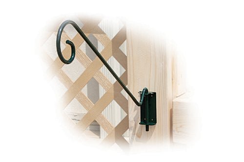 Dark green Woodlink NAMULTI 19" multi-position wall bracket mounted on a wooden lattice structure, showcasing its versatility and durable design.