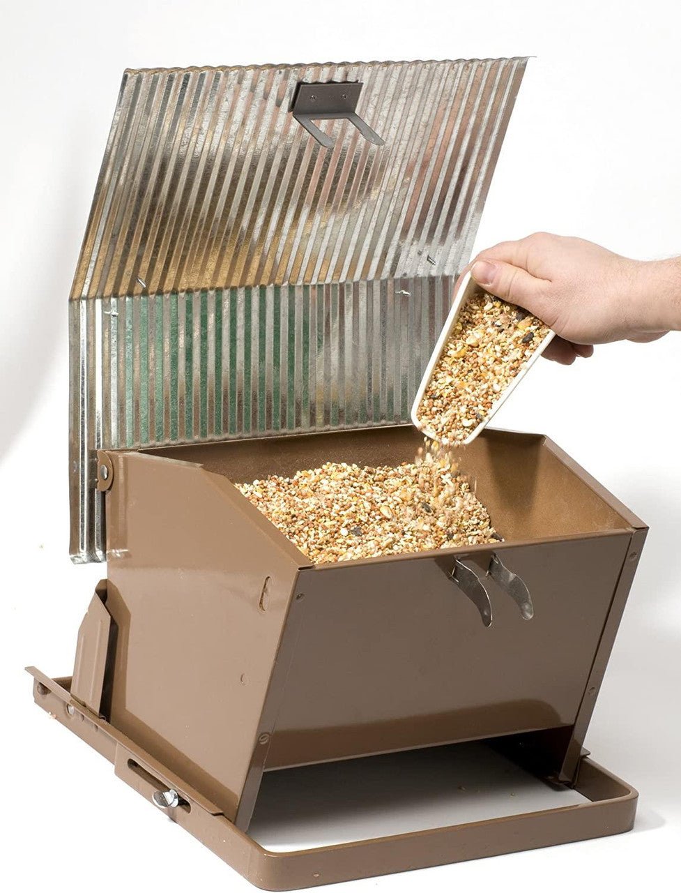 Woodlink Rustic Farmhouse Absolute Feed & Seed Squirrel-Resistant Feeder with open top and seed pouring in.