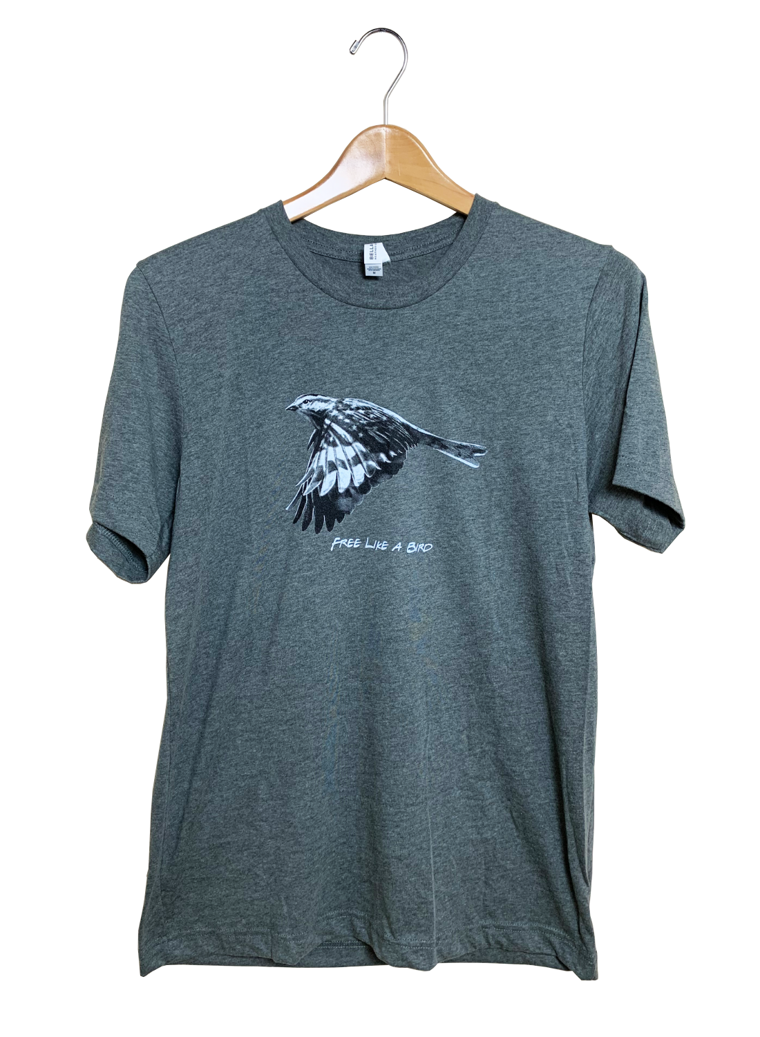 Gray t-shirt featuring a monochrome print of a bird in flight with striking black and white wing patterns and the phrase Free Like a Bird
