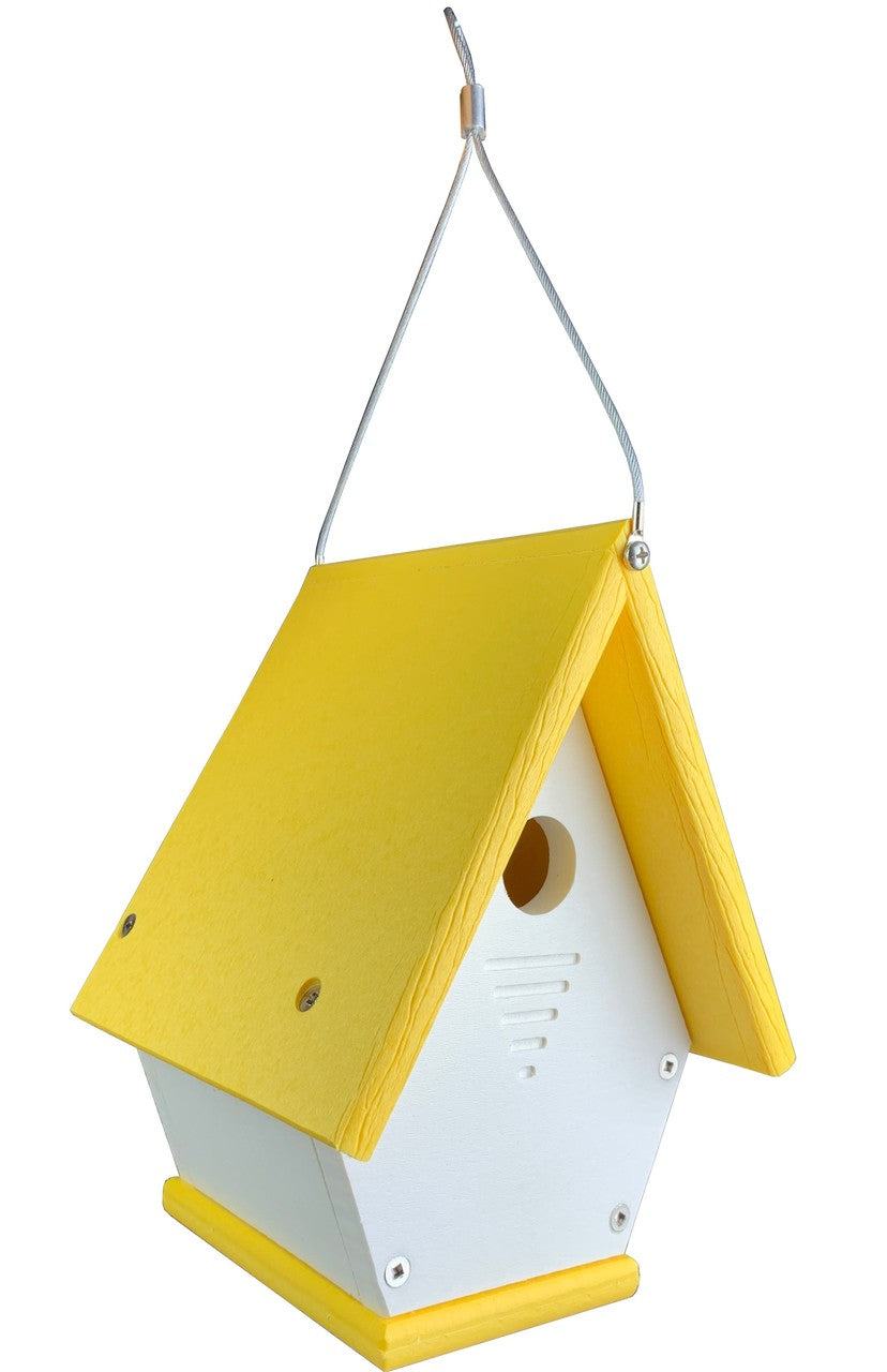 Plastic birdhouse with a bright yellow roof and white body featuring ventilation slots and a hanging wire detail
