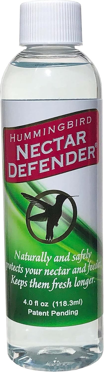 Product shot of Hummingbird Nectar Defender, a clear bottle with a white cap featuring a hummingbird graphic, green accents and red text on the label
