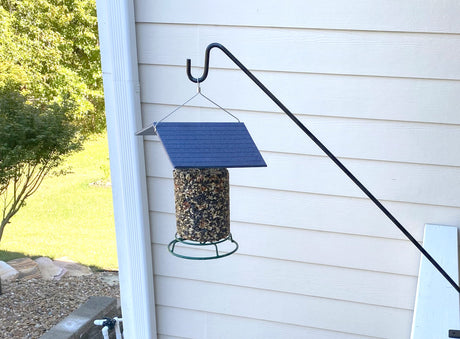 JCS Wildlife Deck Hook with Deck Clamp holding a bird feeder, showcasing garden décor and outdoor space enhancement.