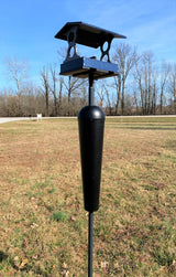 JCS Wildlife Medium Poly Fly Thru Platform Bird Feeder pole mounted in brown grassy field