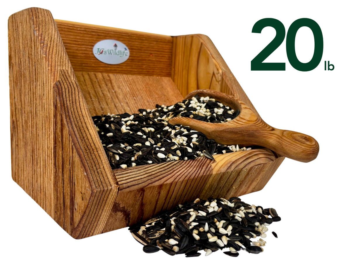 JQsWildlife wooden bird feeder filled with 20 lbs of black oil sunflower seeds white striped sunflower seeds and nyjer seeds in a rustic wooden scoop
