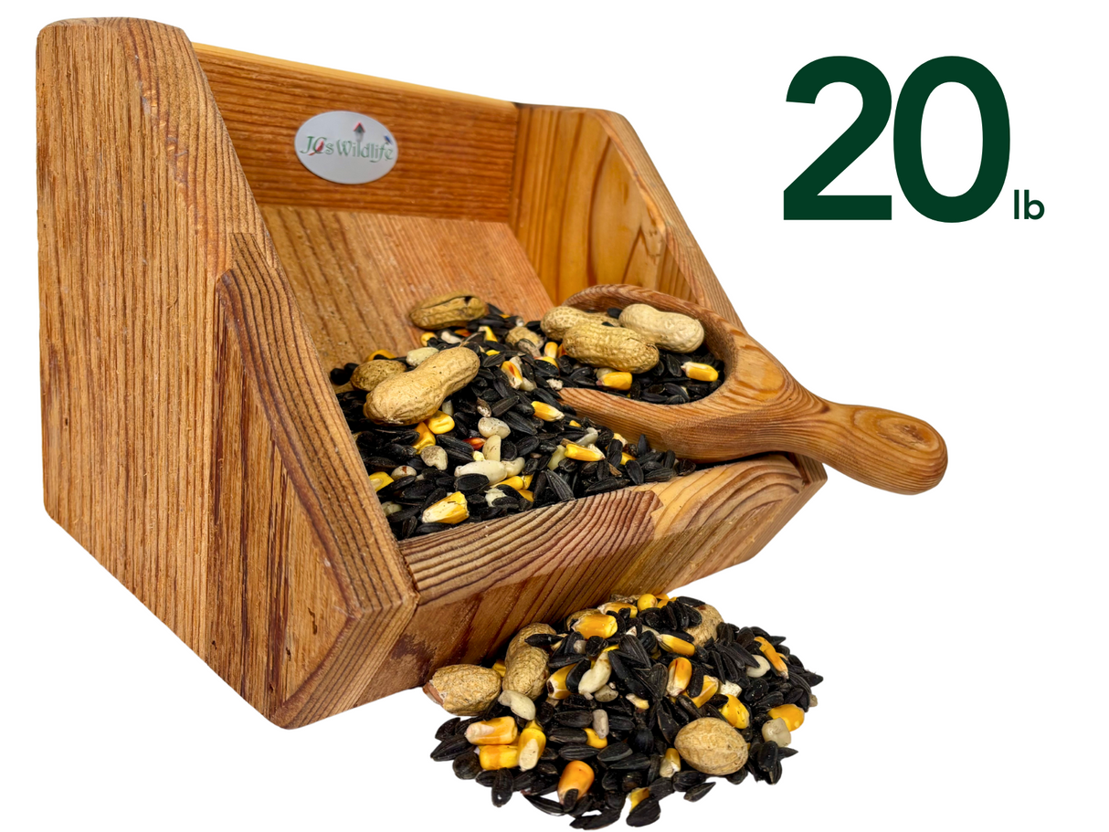 Jos Wildlife wooden bird feeder filled with 20 pounds of birdseed including peanuts corn and sunflower seeds showing rich wood grain and a small wooden scoop