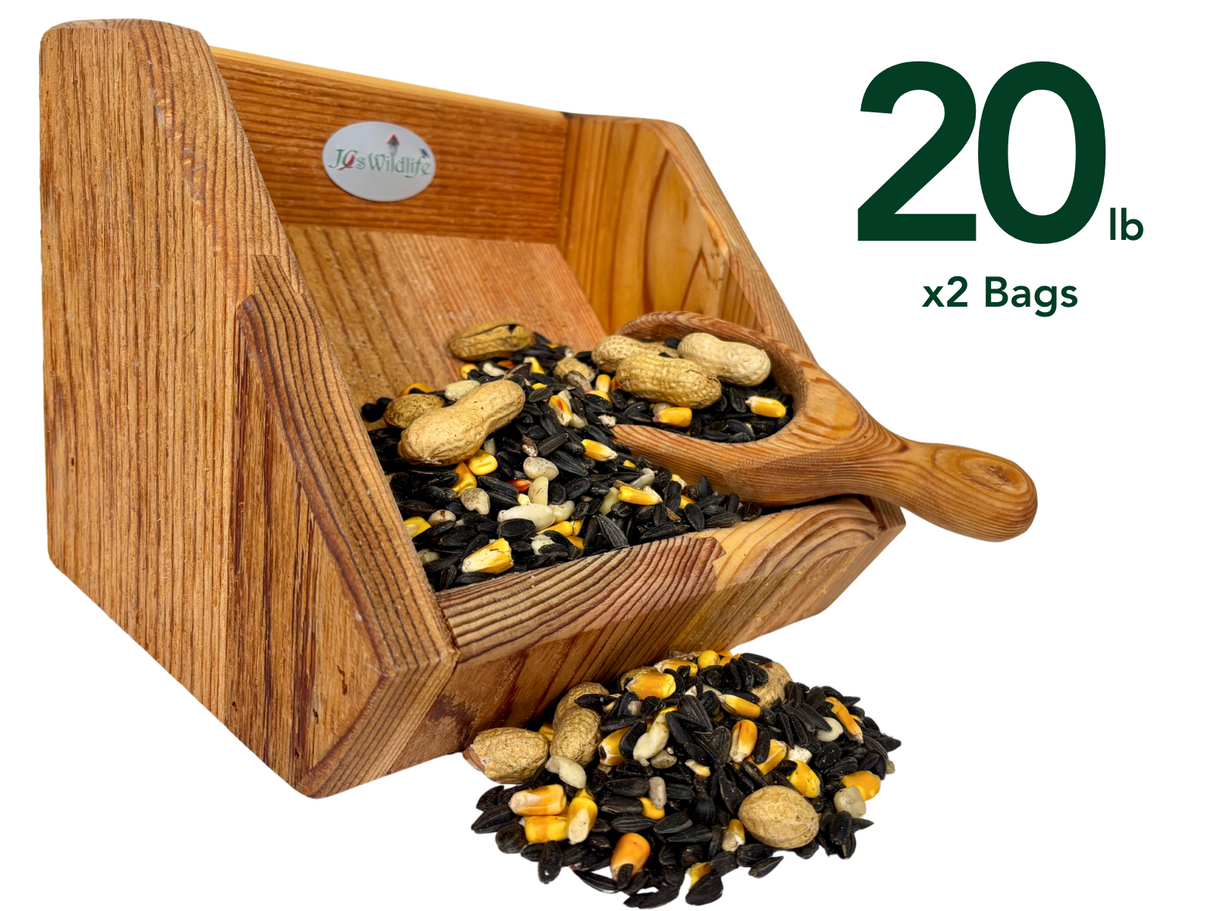 Photograph of a JQs Wildlife wooden bird feeder overflowing with black oil sunflower seeds peanuts and corn kernels in a studio setting