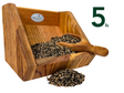 JGsWildlife product photography shows a five pound wooden bird feeder filled with a mix of black and white seeds and a small wooden scoop showcasing the rich wood grain and the varied seed colors
