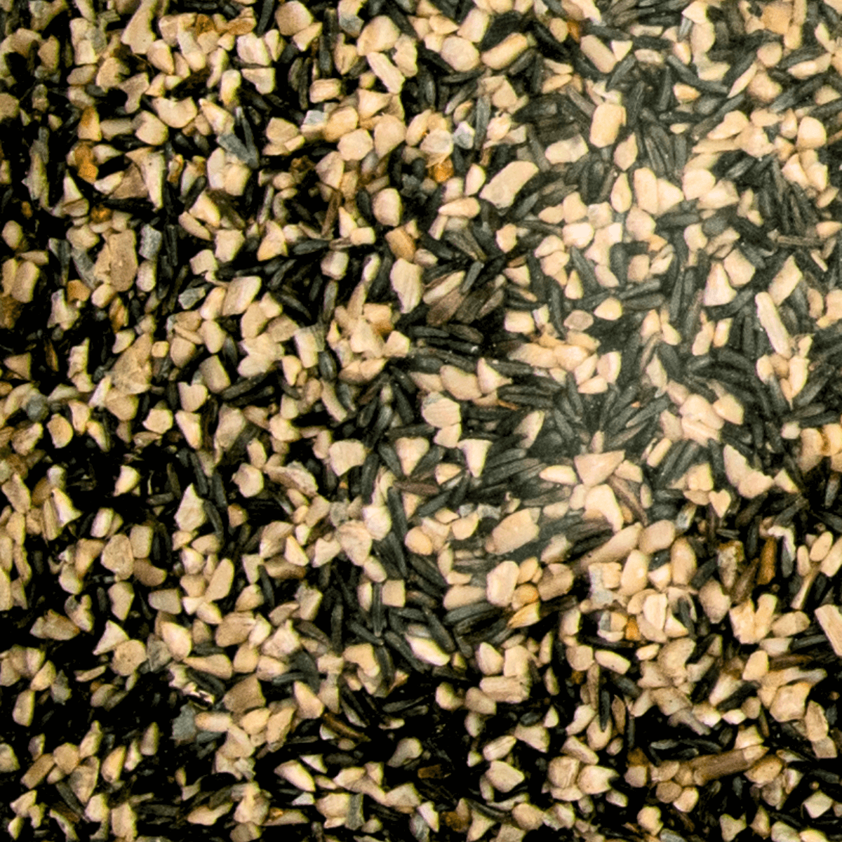 Close-up of JCS Wildlife Finch Favorite 5lb Loose Seed Bag showing Nyjer seeds and fine sunflower chips