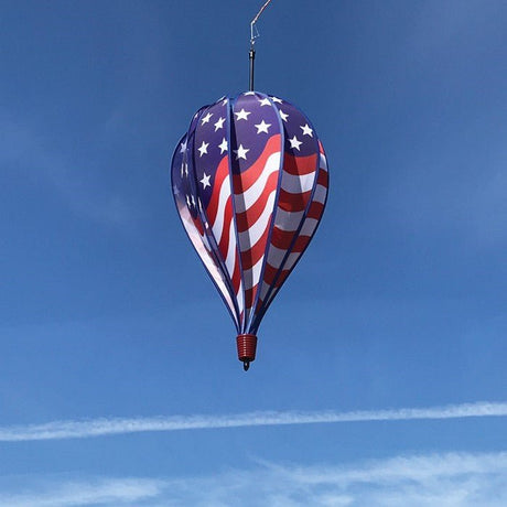 In The Breeze USA Flag 10-Panel Hot Air Balloon Wind Spinner against a clear blue sky