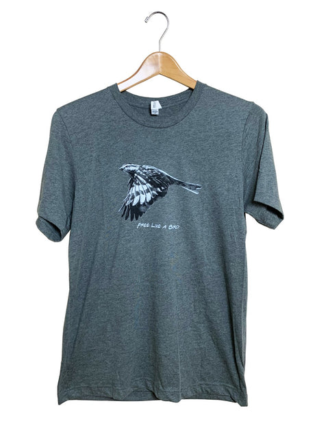 JCS Wildlife Free Like A Bird Heather Grey Unisex Shirt with Bird Graphic on Hanger