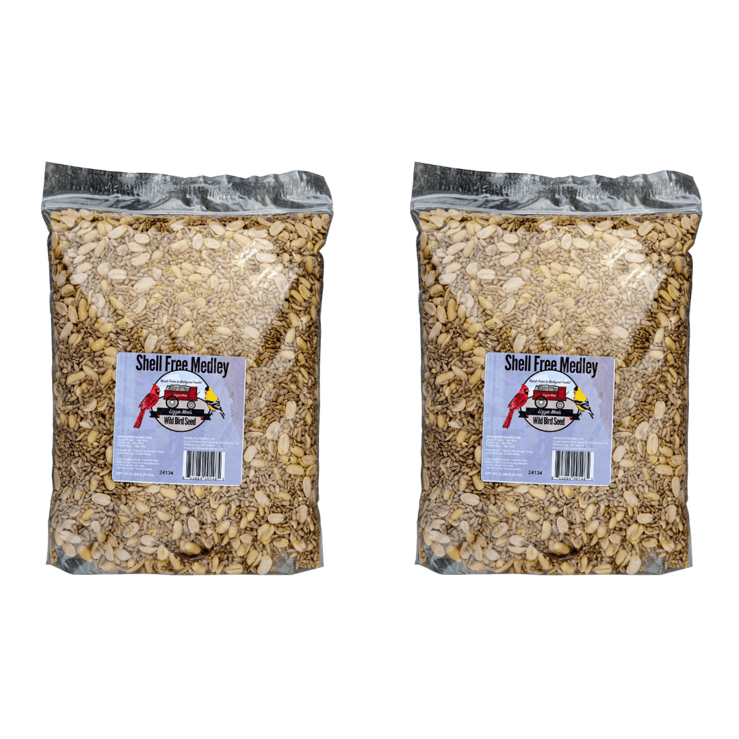 Two bags of JCS Wildlife Shell Free 5lb Loose Seed showing ingredients of Coarse Sunflower Chips, Split Peanuts, and Hulled Millet