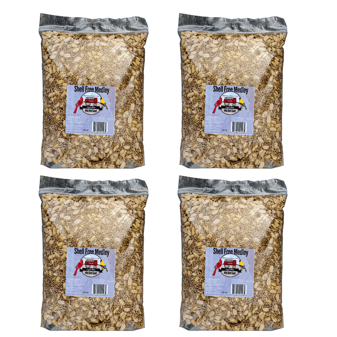 Four bags of JCS Wildlife Shell Free 5lb Loose Seed, containing coarse sunflower chips, split peanuts, and hulled millet.