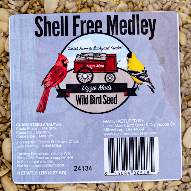 Label of Lizzie Mae's Shell Free Medley Wild Bird Seed with ingredients and guaranteed analysis on a bed of coarse sunflower chips.