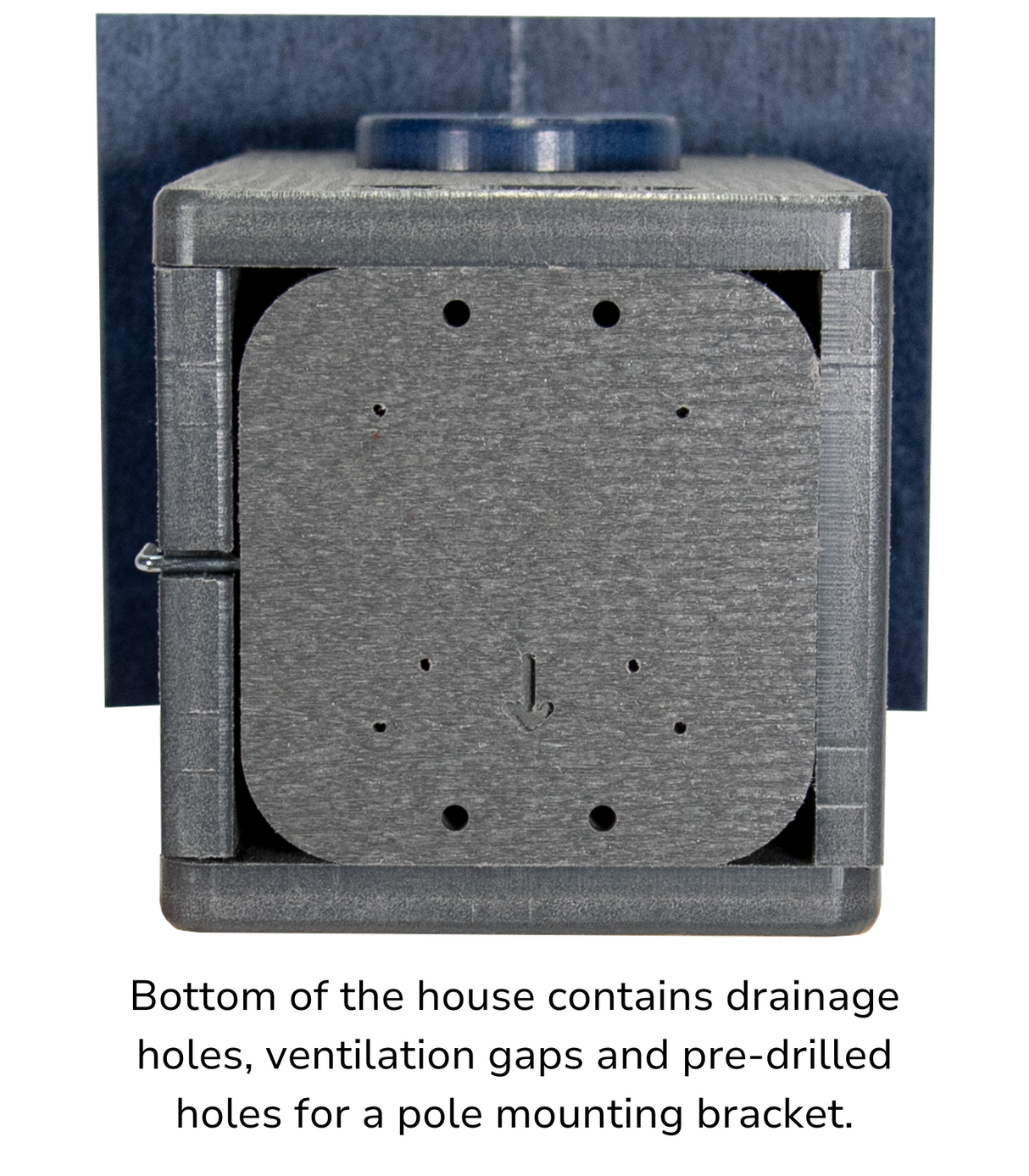 This photo shows the bottom of the bluebird house with text that reads, "Bottom of the house contains drainage holes, ventilation gaps and pre-drilled holes for a pole mounting bracket"