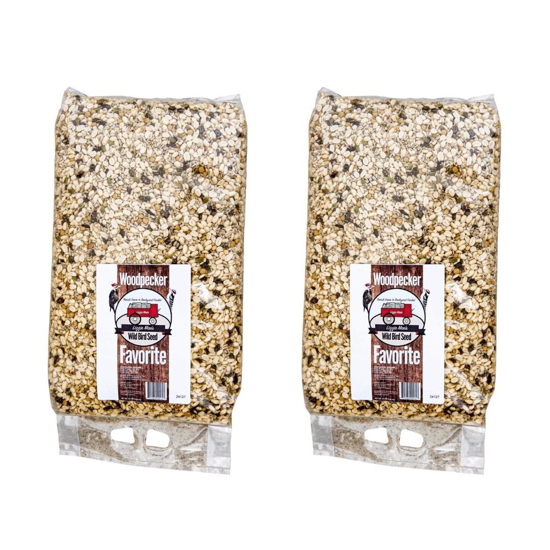 Two bags of JCS Wildlife Woodpecker Favorite 20lb Loose Seed Mix featuring suet, nuts, and dried fruit for woodpeckers and backyard birds.