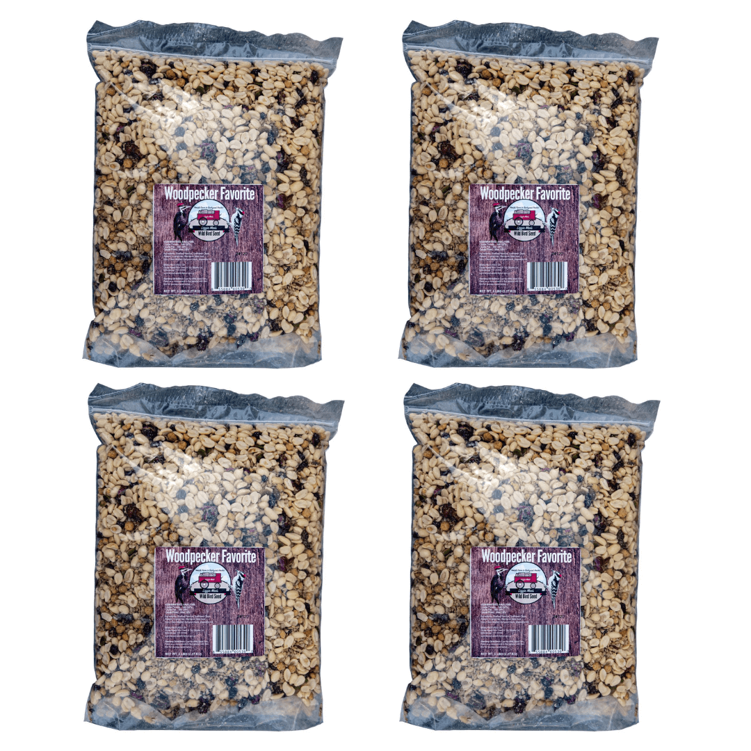 Four 5lb bags of JCS Wildlife Woodpecker Favorite seed mix containing shell-free suet, nuts, and dried fruit.