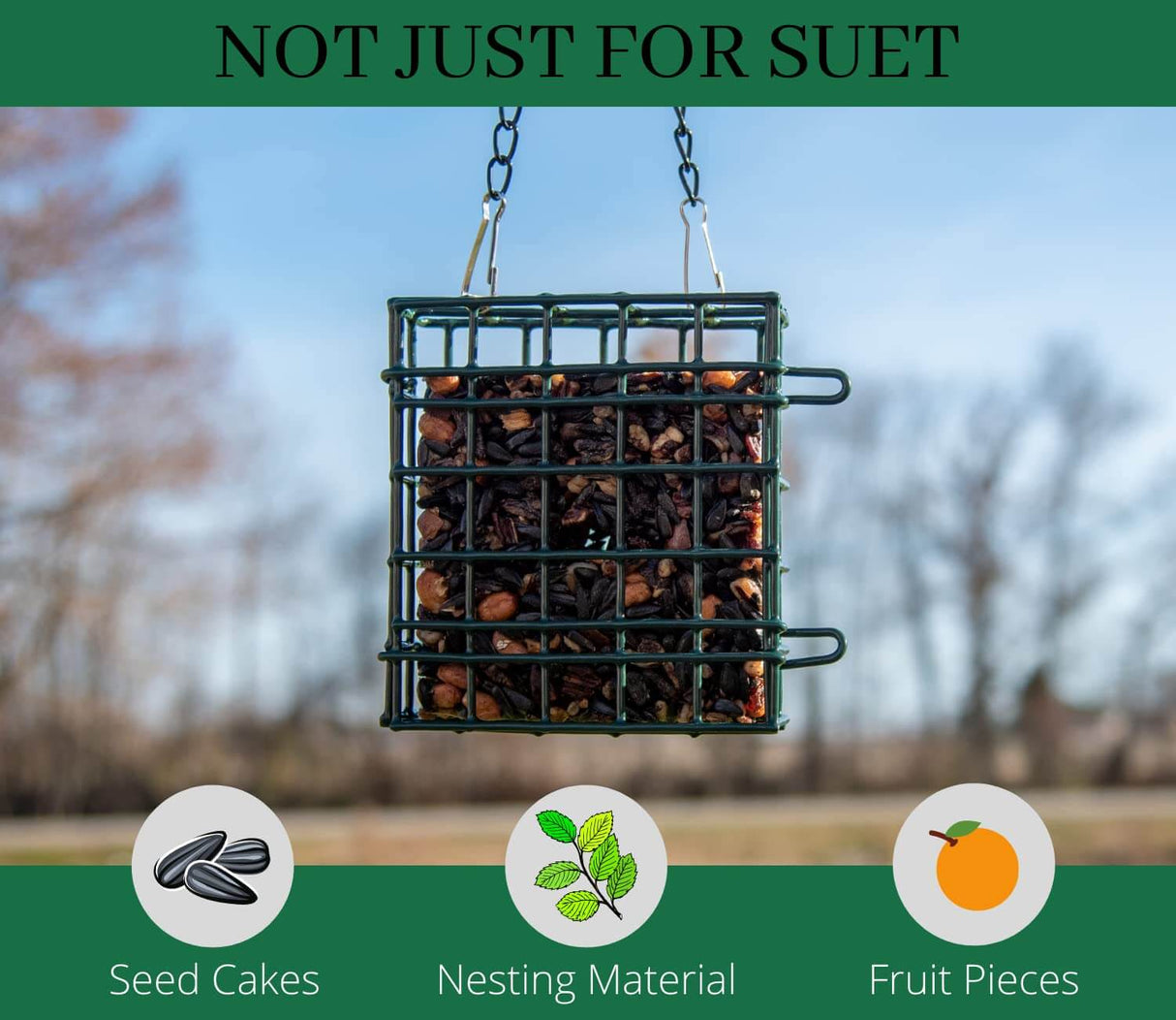 JCs Wildlife Single Suet Cage Bird Feeder holding seed cakes, nesting material, and fruit pieces hanging outside